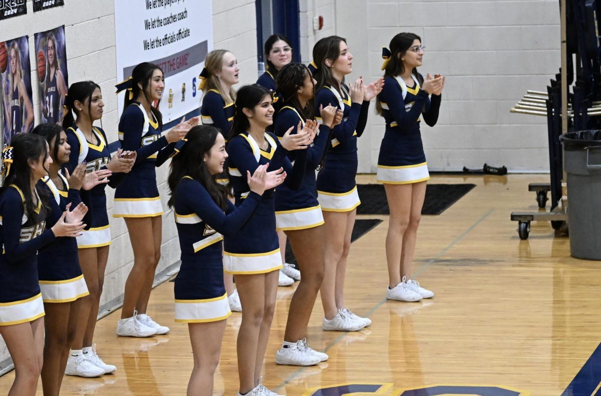 The cheer team at the boys basketball game against Wyoming.