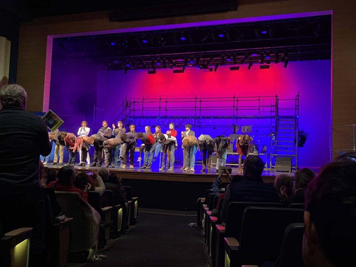 The cast of RENT performs in the Schiff Center.