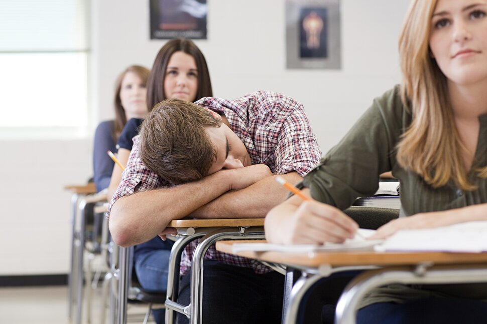 Student falls asleep in class due to a lack of sleep the night before.