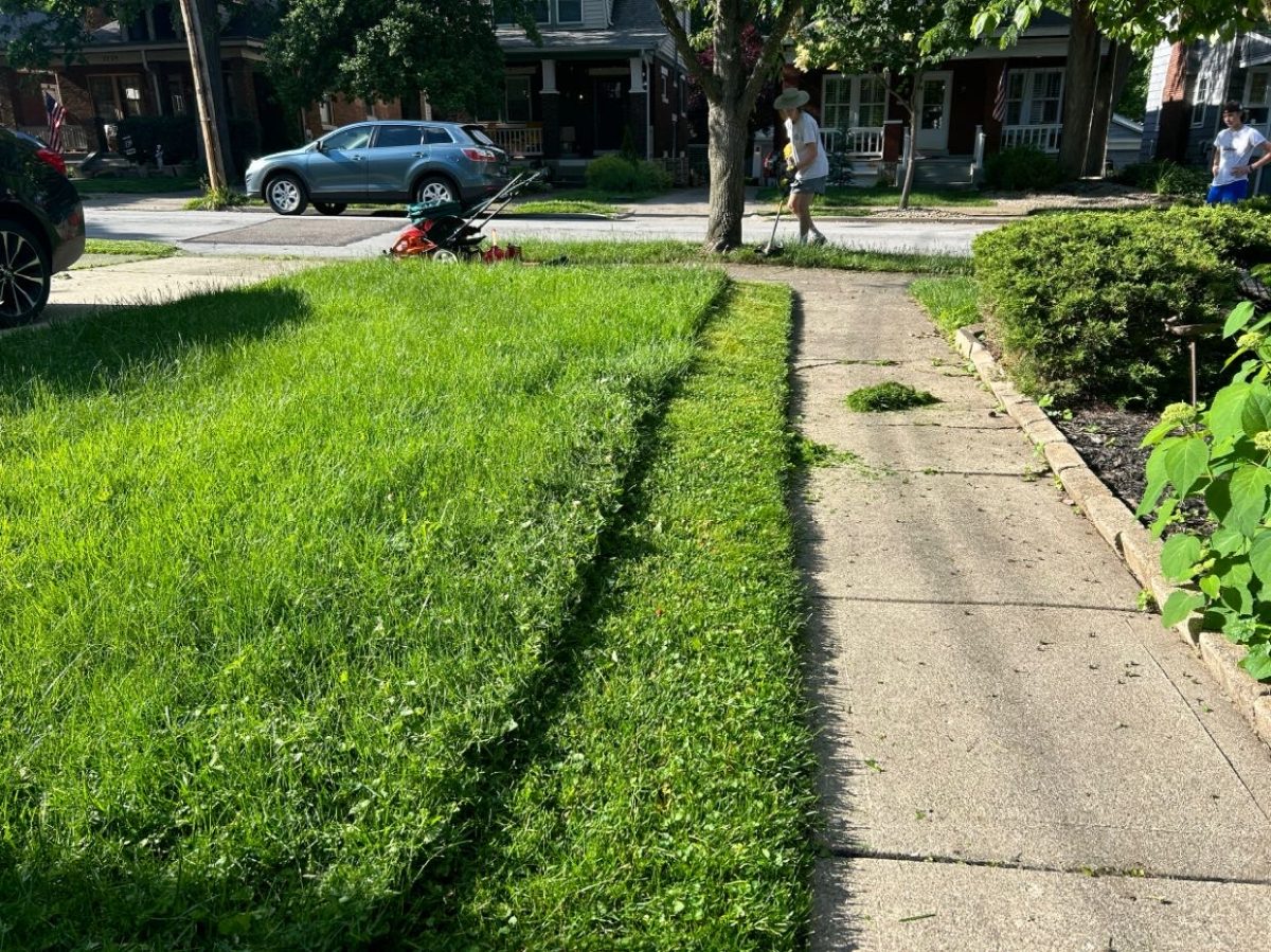 Sophomore Abott Hoffman Suder mowing a lawn