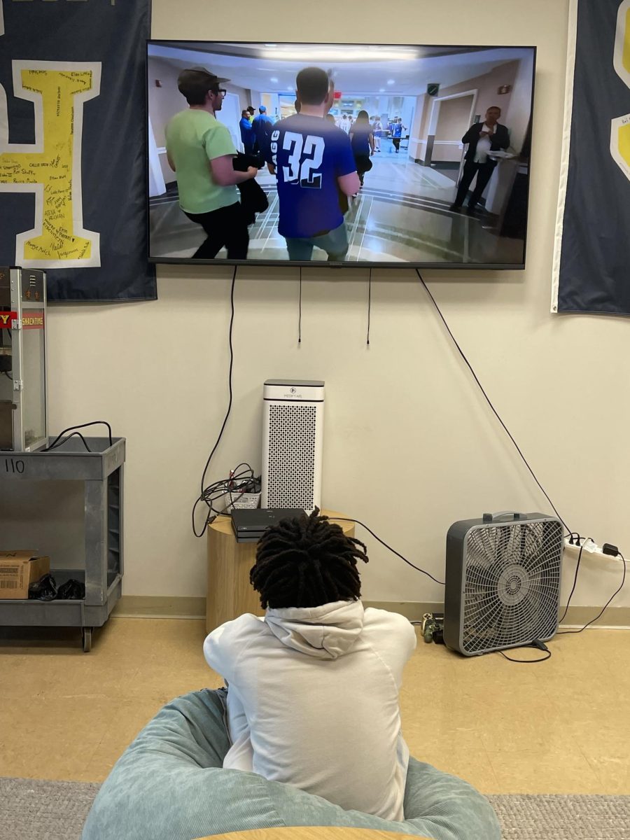 Senior Thurmond Ellison sits in a beanbag chair, as he watches YouTube on the brand new 70-inch TV