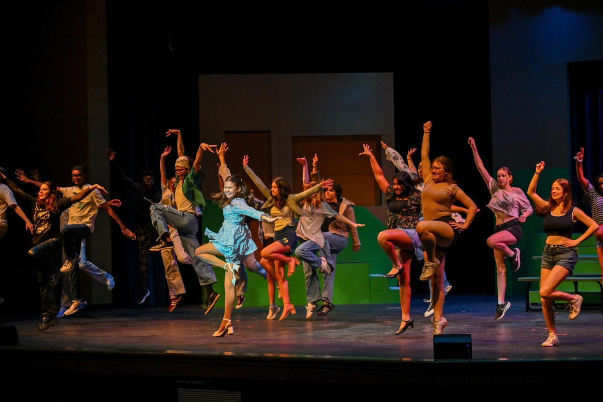 The Mean Girls cast performs “Fearless” on stage. 