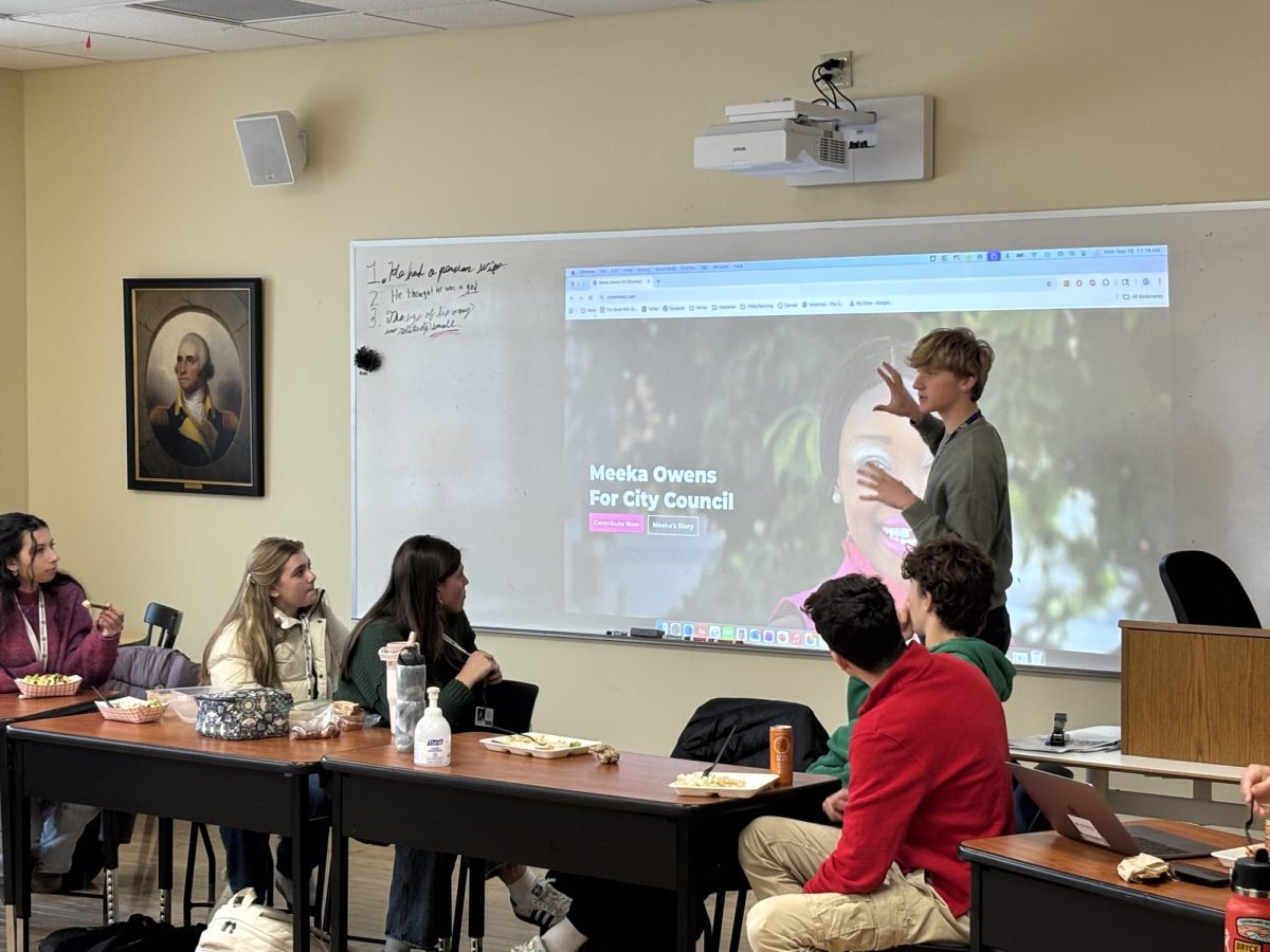 A student shares out at Salon club. 