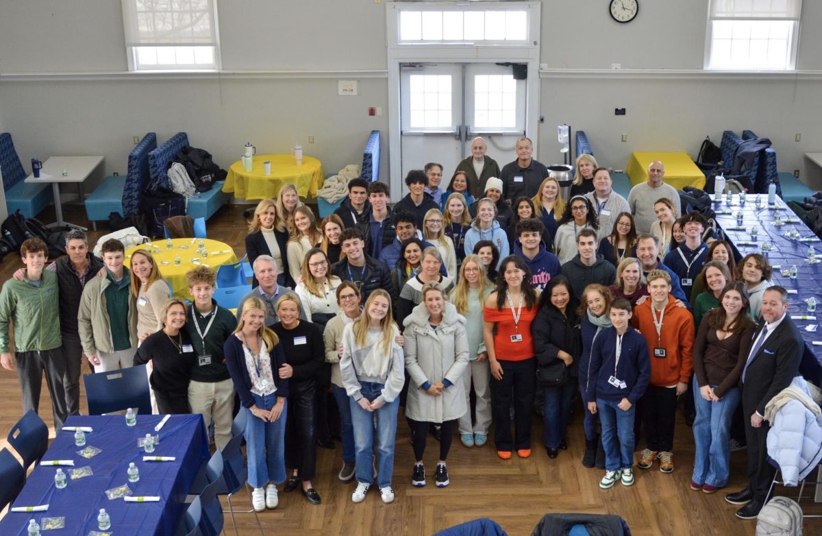 A group photo at the lifer's lunch with 2026 graduates and their parents